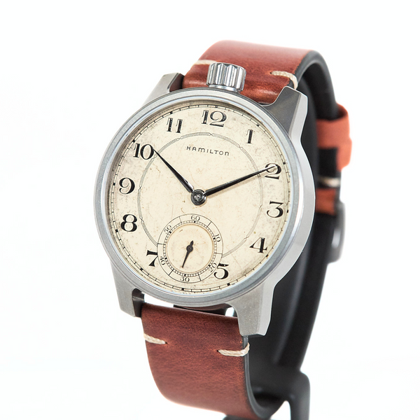 Hamilton watch with a brown leather strap on a white background