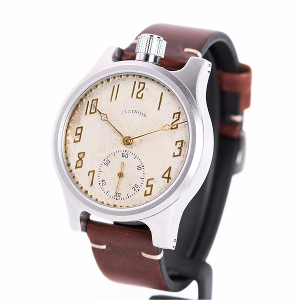 Wristwatch with brown leather strap and beige dial on a white background